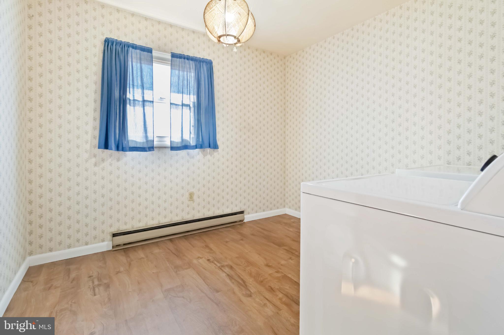 6216 Blue Grass Avenue Harrisburg, PA 17112 - Photo 13 of 23 a view of empty room with wooden floor