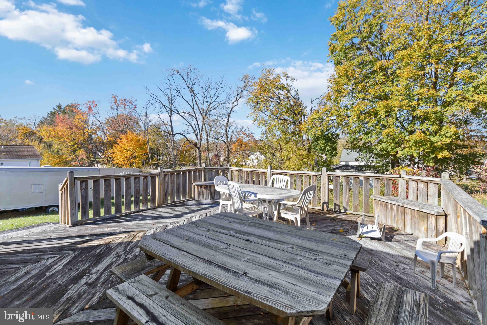 6216 Blue Grass Avenue Harrisburg, PA 17112 - Photo 23 of 23 a view of a roof deck with wooden floor and fence with a bench
