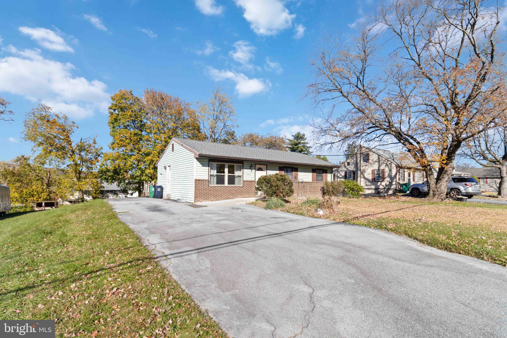 6216 Blue Grass Avenue Harrisburg, PA 17112 - Photo 3 of 23 a view of a house with a yard and tree s