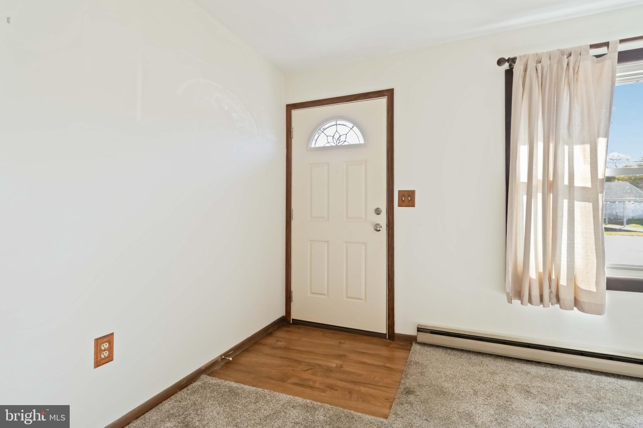 6216 Blue Grass Avenue Harrisburg, PA 17112 - Photo 5 of 23 a view of an empty room with window