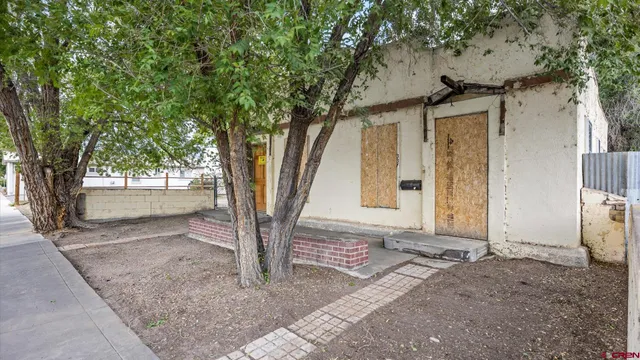 a house with a tree in front of it