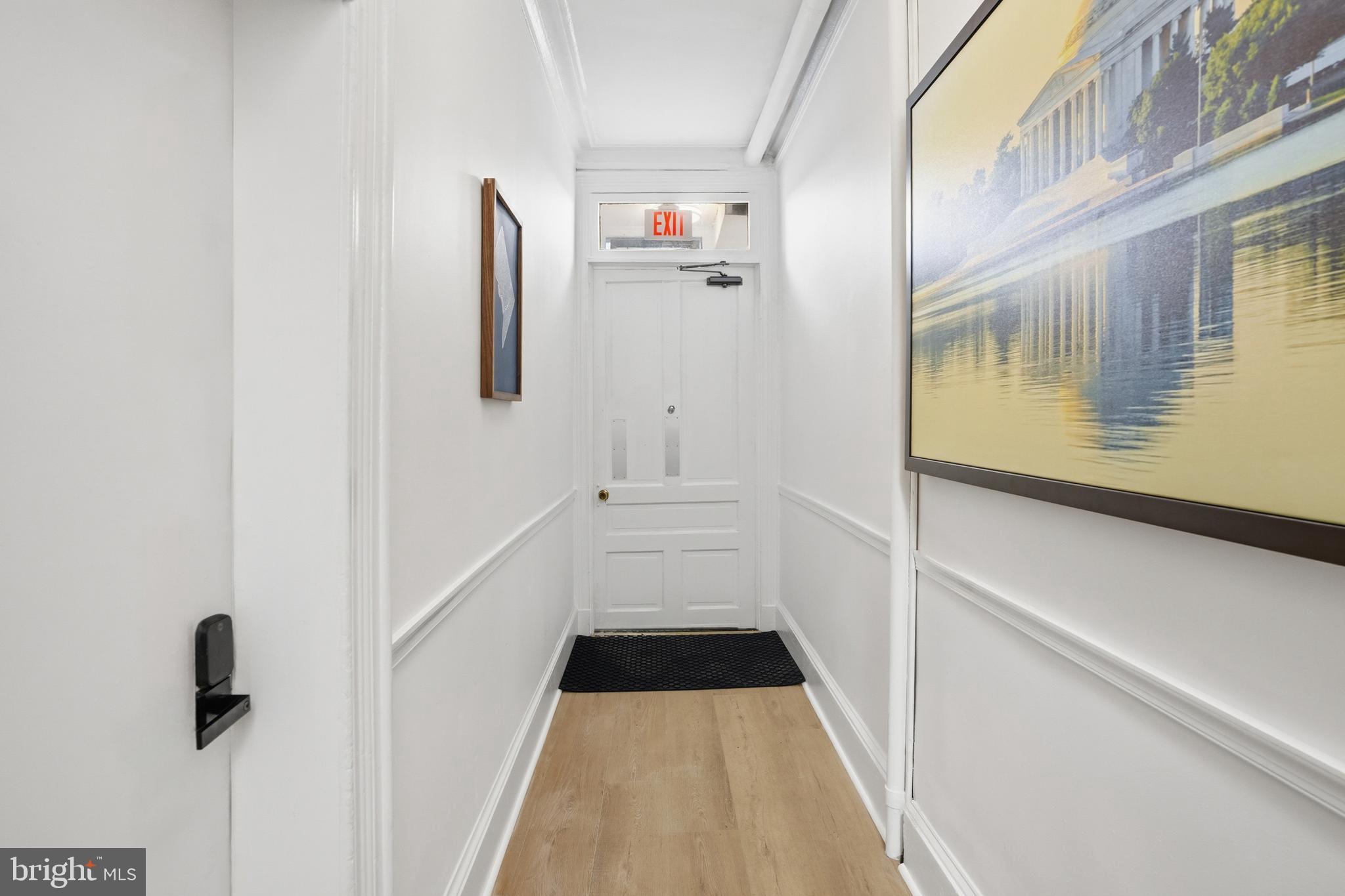 313 C Street Southeast Washington, DC 20003 - Photo 22 of 47 a view of a hallway with wooden floor and staircase