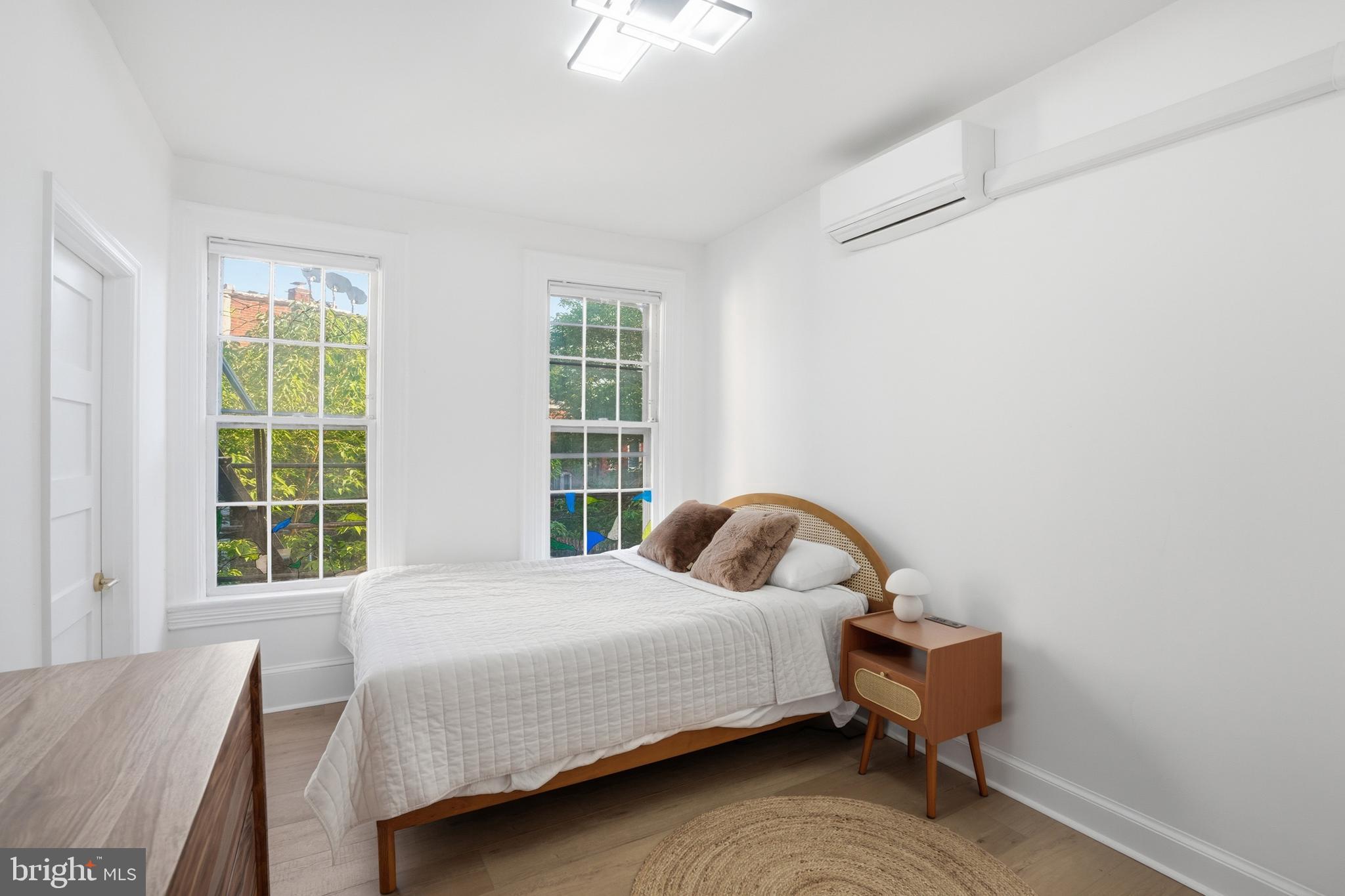 313 C Street Southeast Washington, DC 20003 - Photo 27 of 47 a bedroom with a bed and a window