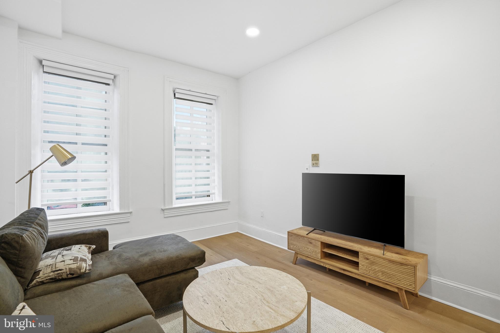 313 C Street Southeast Washington, DC 20003 - Photo 28 of 47 a living room with furniture and a flat screen tv