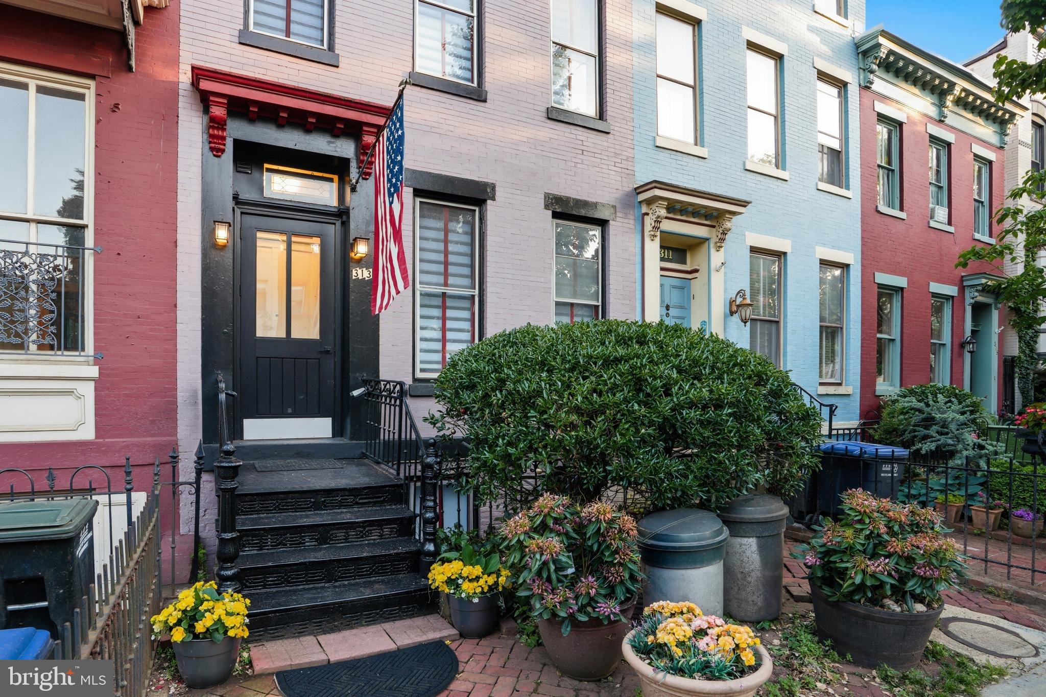 313 C Street Southeast Washington, DC 20003 - Photo 46 of 47 a front view of a house with outdoor seating and plants