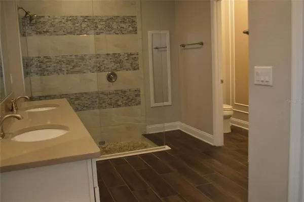 a bathroom with a sink and a shower