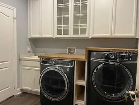 a utility room with dryer and washer