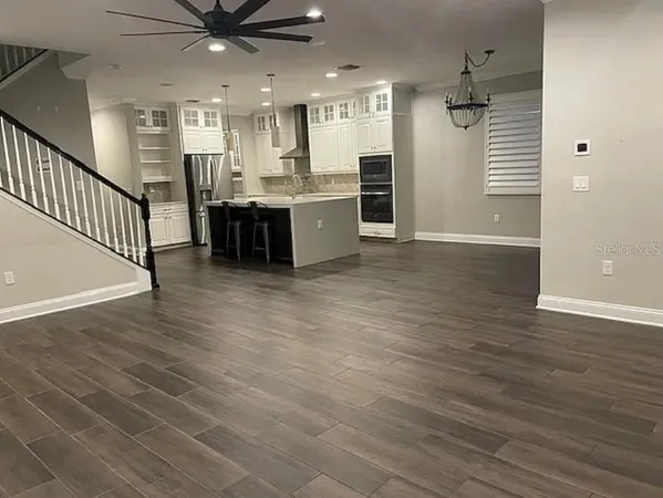 a view of a kitchen with a sink and microwave