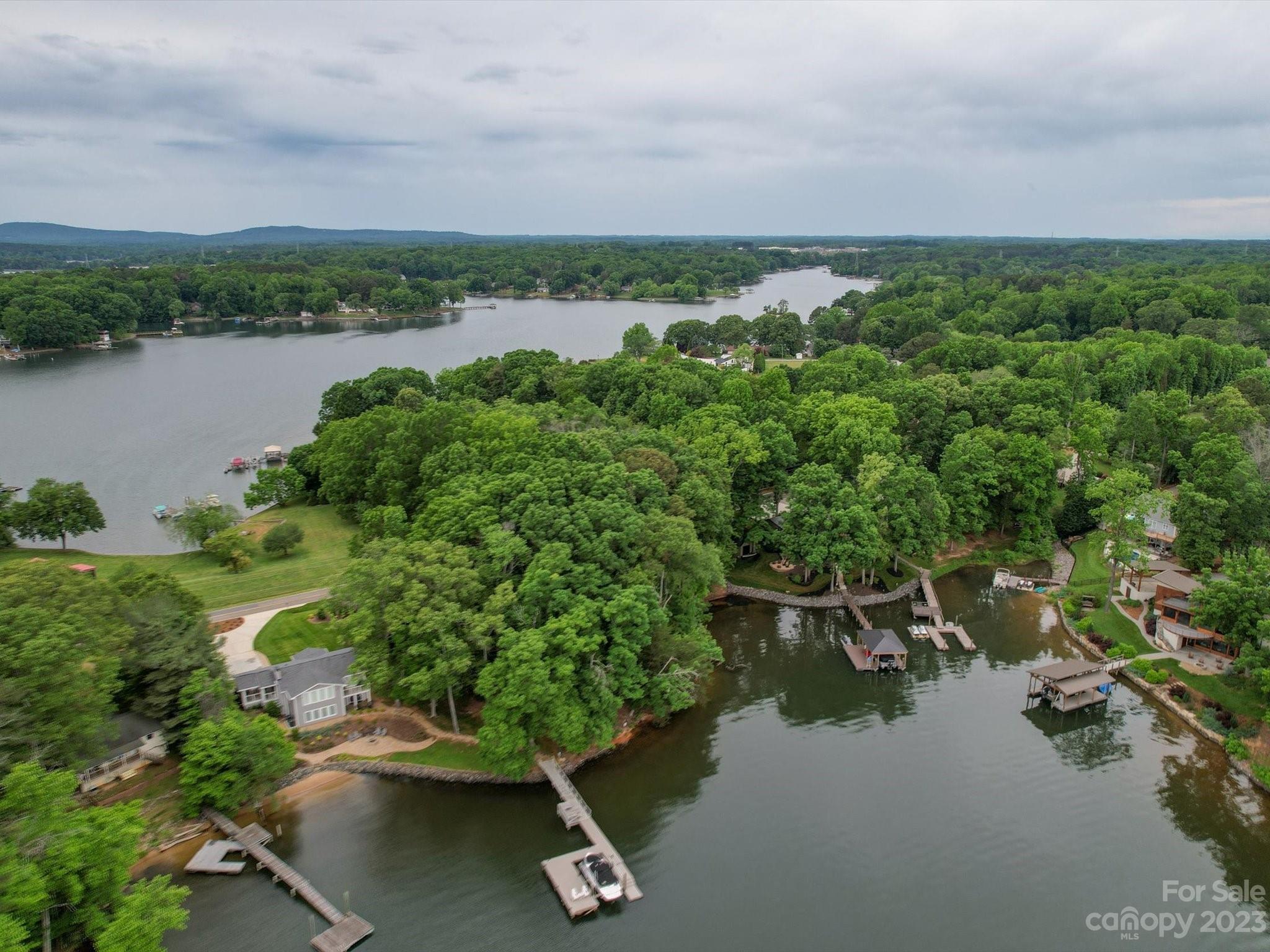 4614 Kiser Island Road Terrell, NC 28682 - Photo 12 of 28 a view of a lake with a mountain in the background