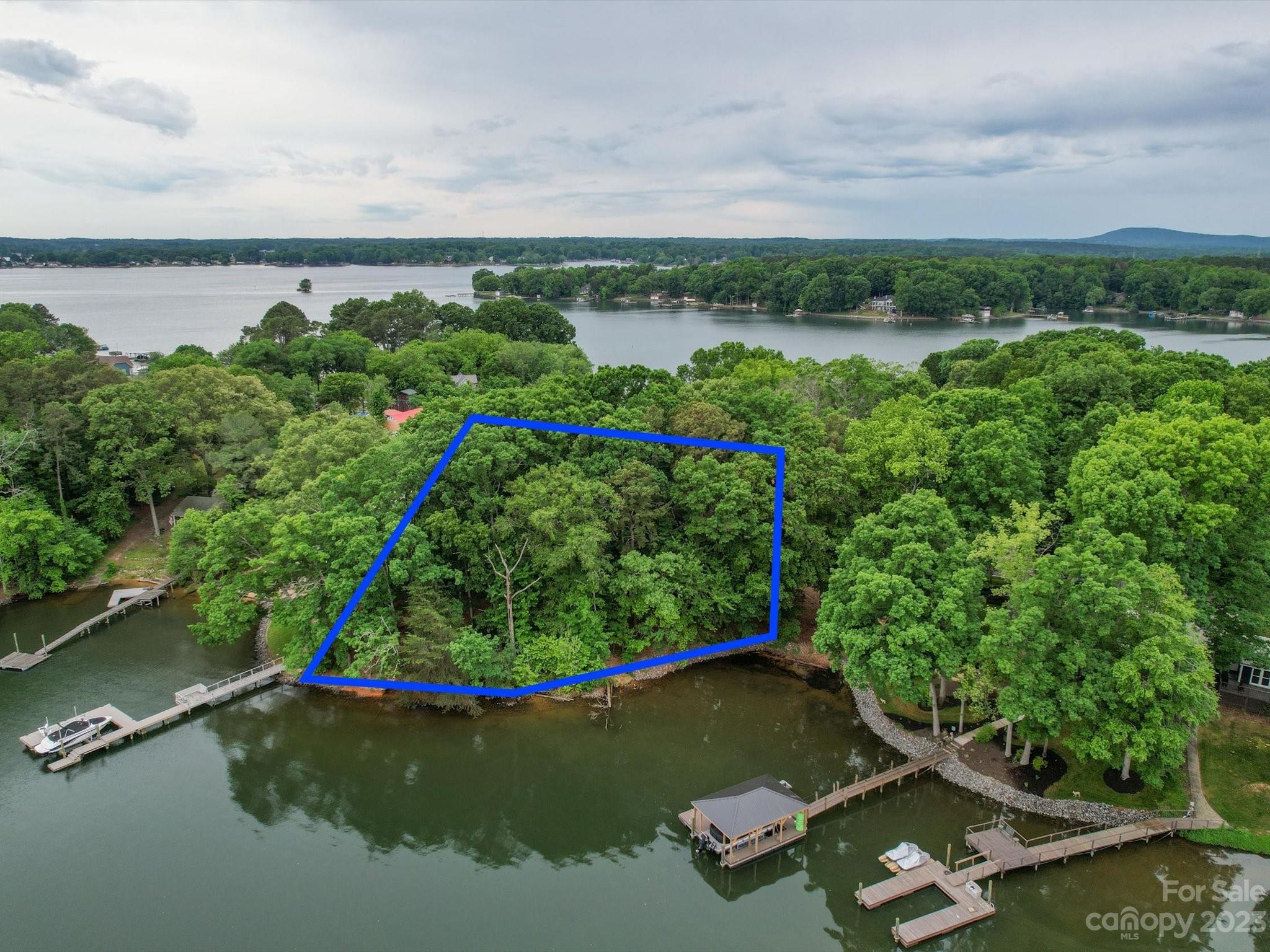 4614 Kiser Island Road Terrell, NC 28682 - Photo 16 of 28 an aerial view of a residential house with a yard and lake view