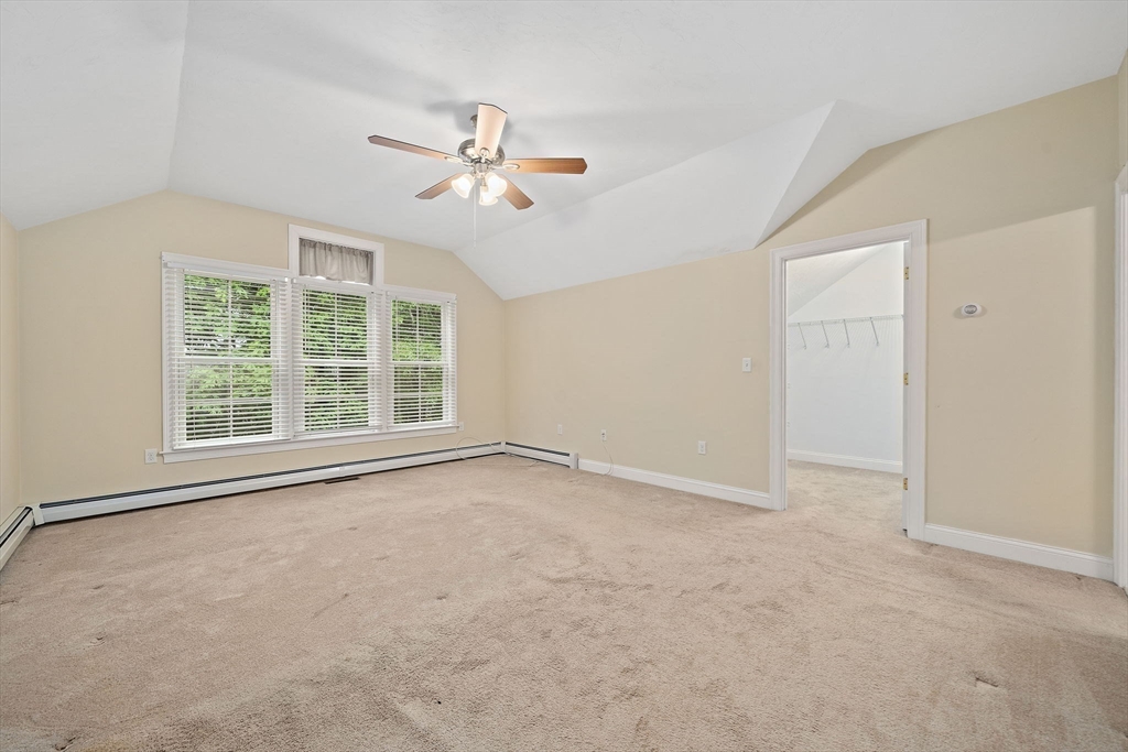 14 Sugar Maple Circle, Unit 14 Hanover, MA 02339 - Photo 23 of 38 an empty room with windows and fan