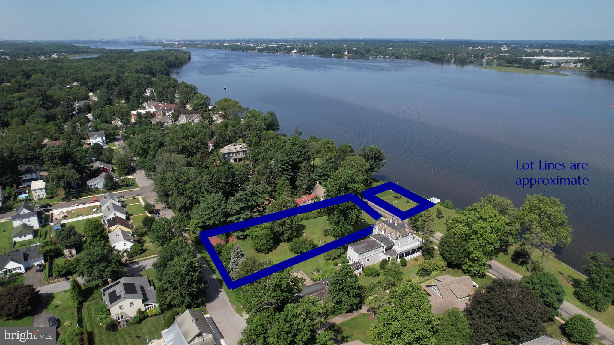 0 Delaware Avenue Delanco, NJ 08075 - Photo 13 of 39 a view of a lake with sitting area and garden