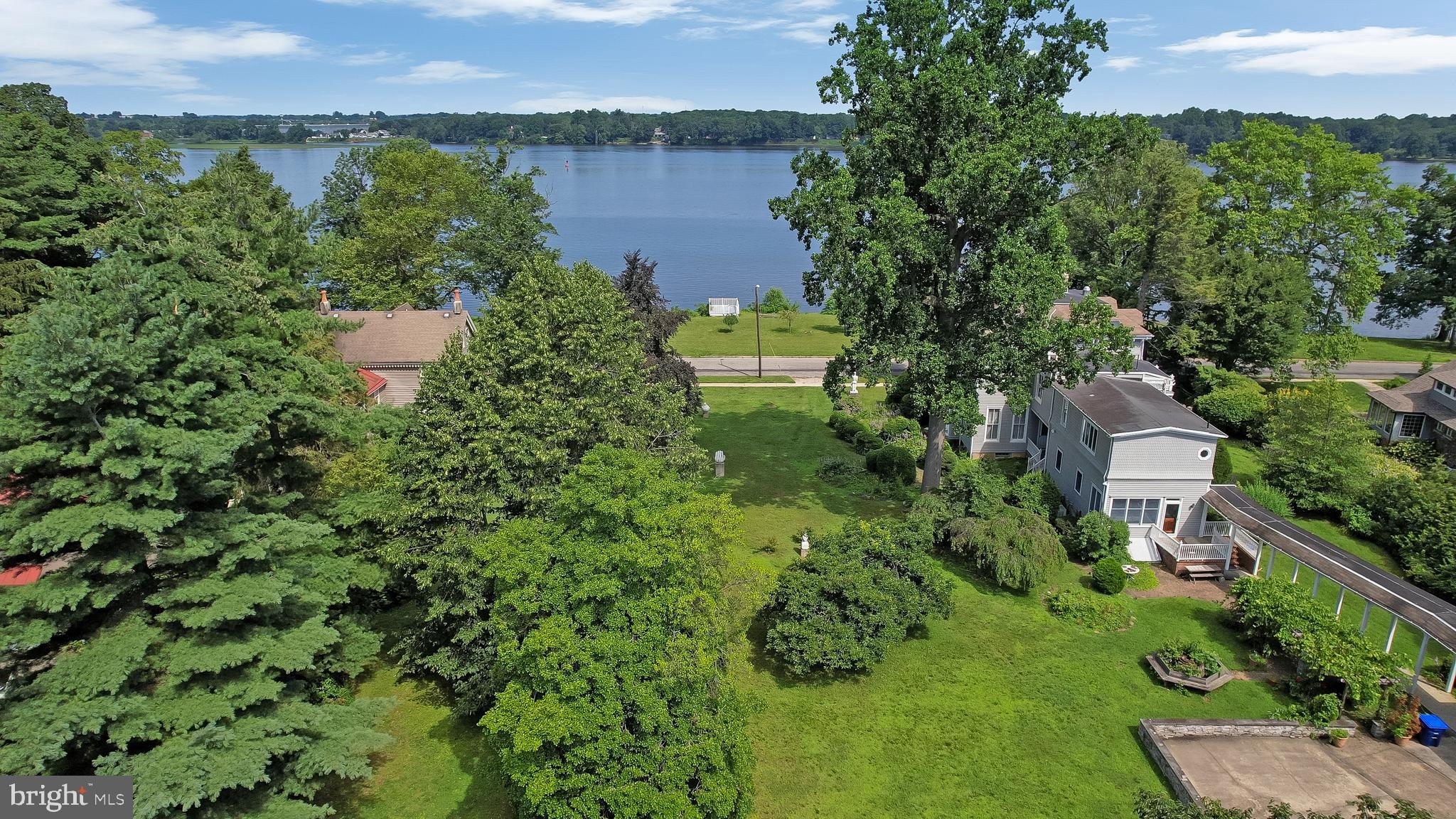 0 Delaware Avenue Delanco, NJ 08075 - Photo 32 of 39 an aerial view of a house with a yard and lake view