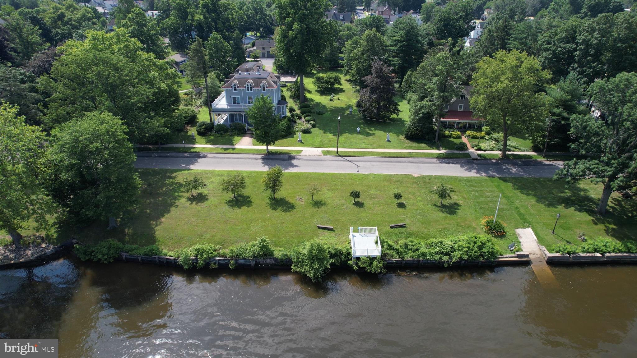 0 Delaware Avenue Delanco, NJ 08075 - Photo 6 of 39 an aerial view of a house with a yard and lake view