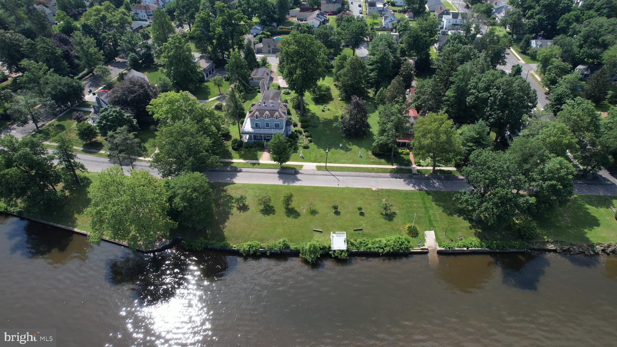 0 Delaware Avenue Delanco, NJ 08075 - Photo 7 of 39 an aerial view of a house with a yard and lake view