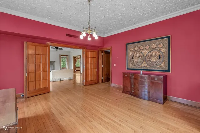 a view of a livingroom with furniture wooden floor and window