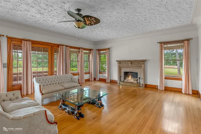 a living room with furniture and a fireplace