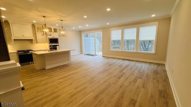 a view of kitchen and wooden floor