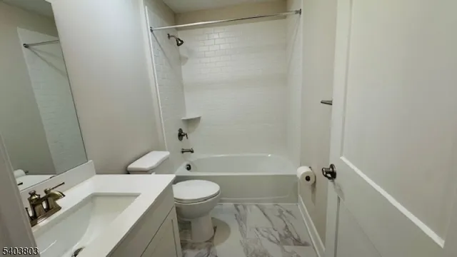 a bathroom with a sink a toilet and a bathtub