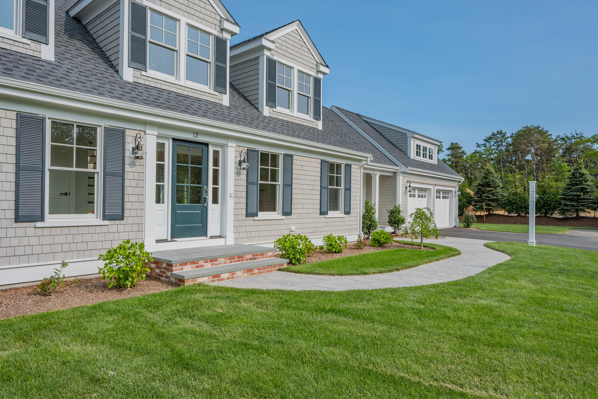 12 Turtle Run Harwich, MA 02645 - Photo 3 of 38 a front view of a house with a yard