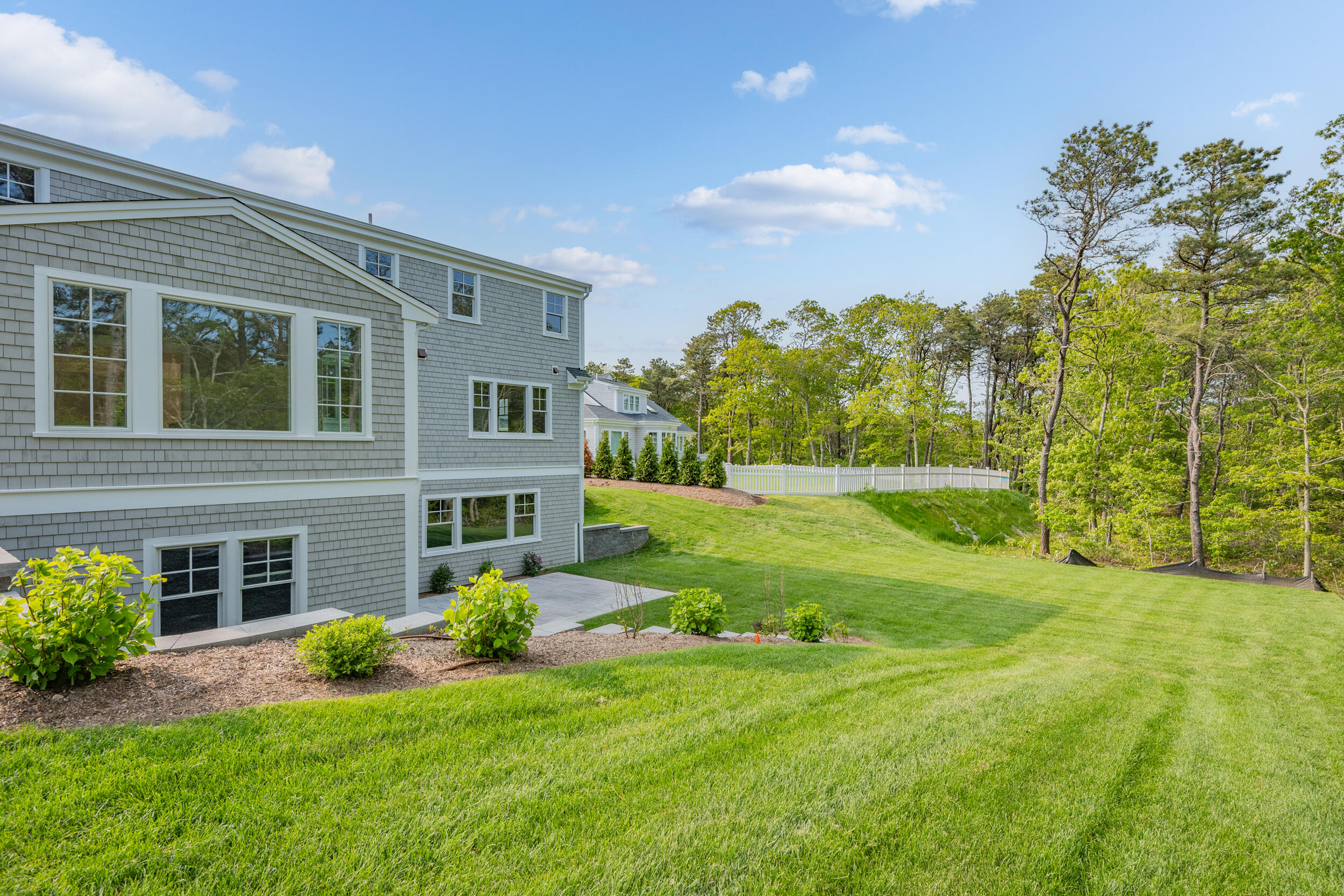 12 Turtle Run Harwich, MA 02645 - Photo 32 of 38 a view of a house with a yard and sitting area