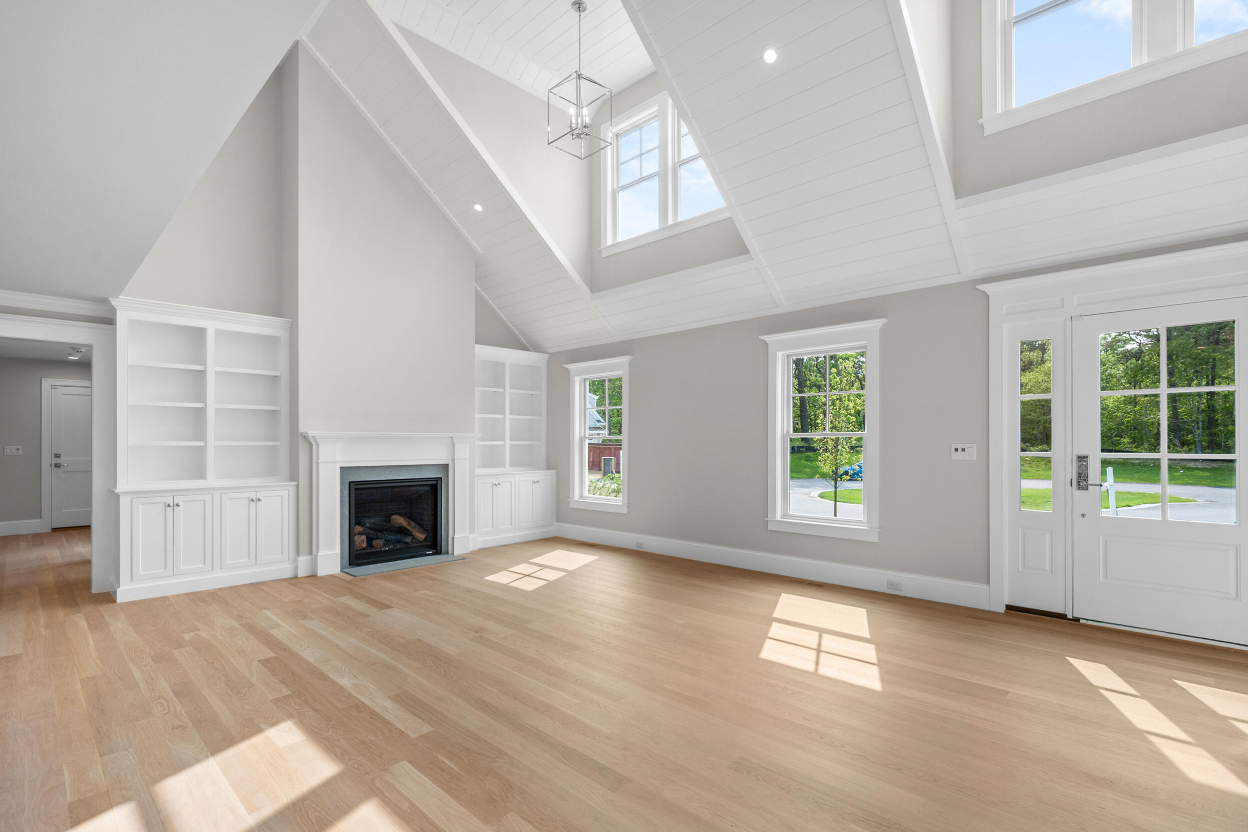 12 Turtle Run Harwich, MA 02645 - Photo 6 of 38 a view of empty room with windows and fireplace