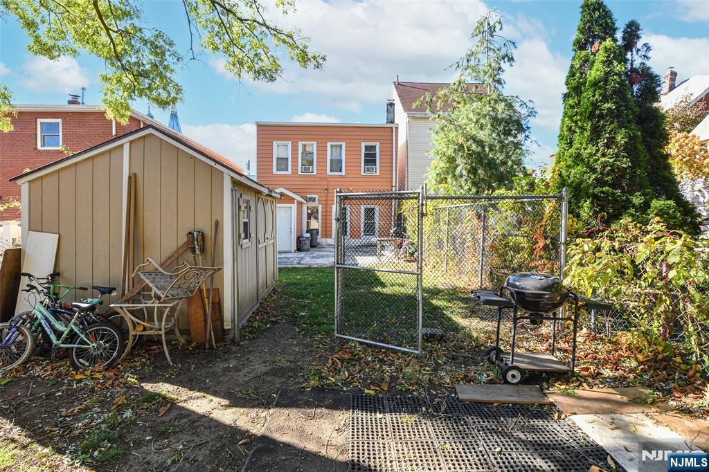 208 4th Street Passaic, NJ 07055 - Photo 26 of 28 a view of a house with backyard and sitting area