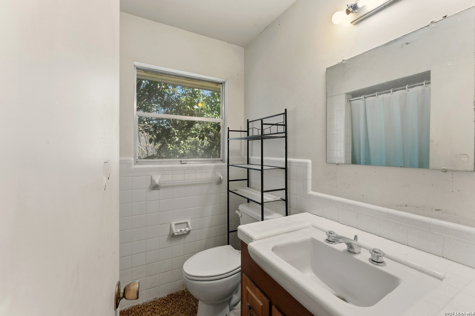 3394 Junction Highway Ingram, TX 78025 - Photo 12 of 28 a bathroom with a sink toilet and mirror