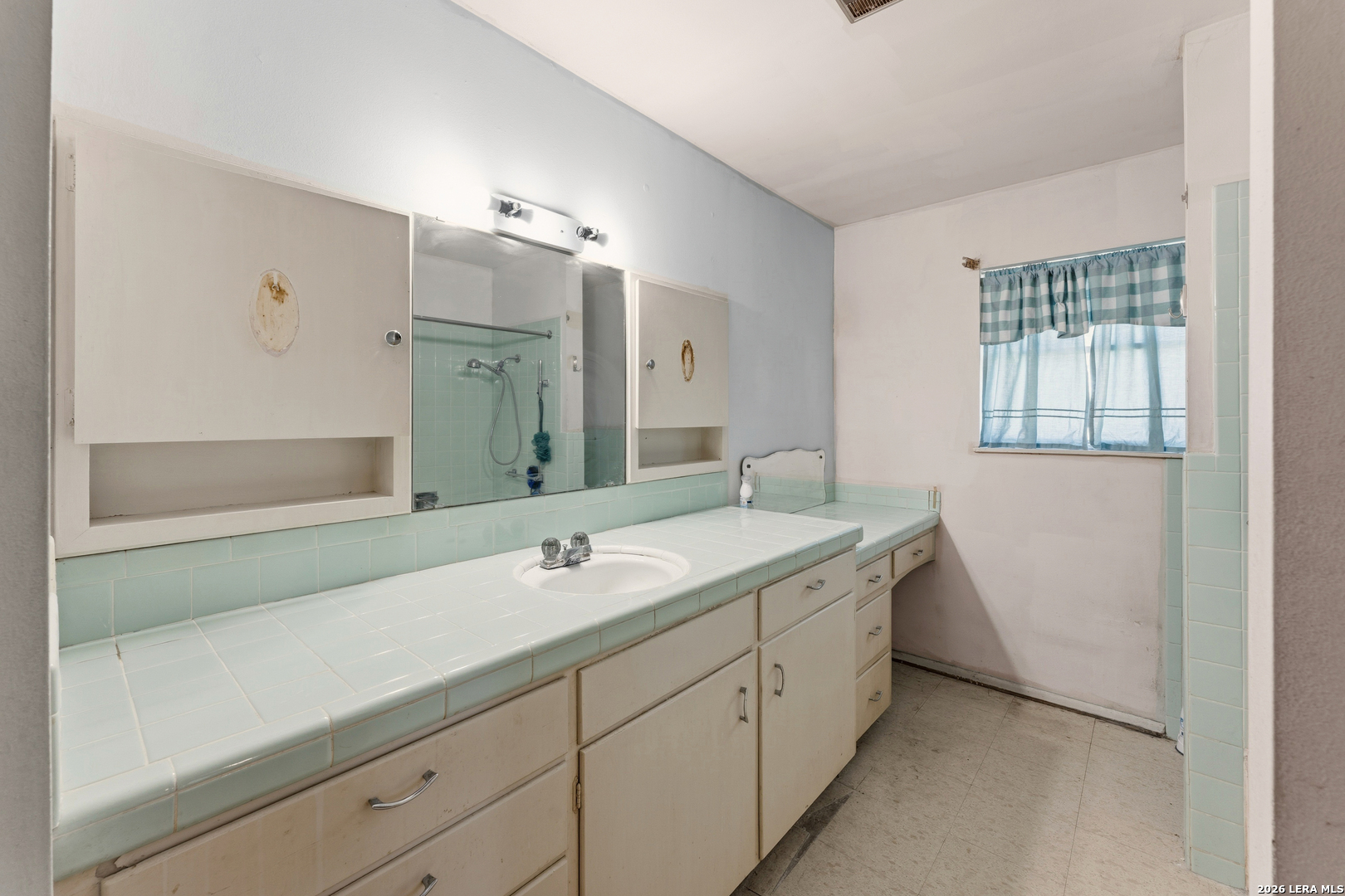 3394 Junction Highway Ingram, TX 78025 - Photo 8 of 28 a spacious bathroom with a shower sink and mirror