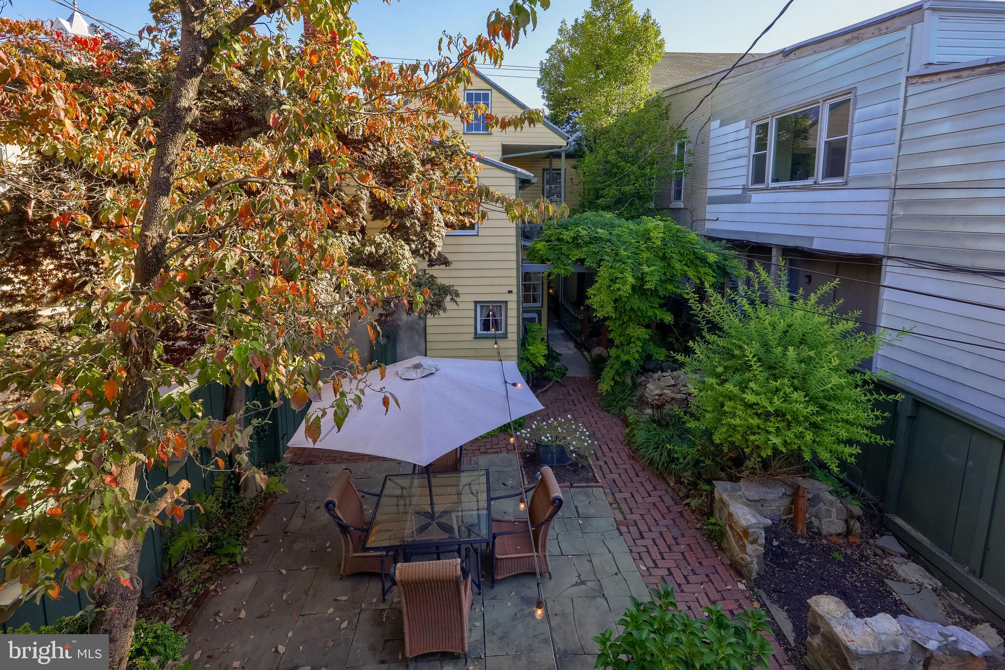 2 South Charlotte Street Manheim, PA 17545 - Photo 21 of 88 a view of a backyard with plants and a barbeque