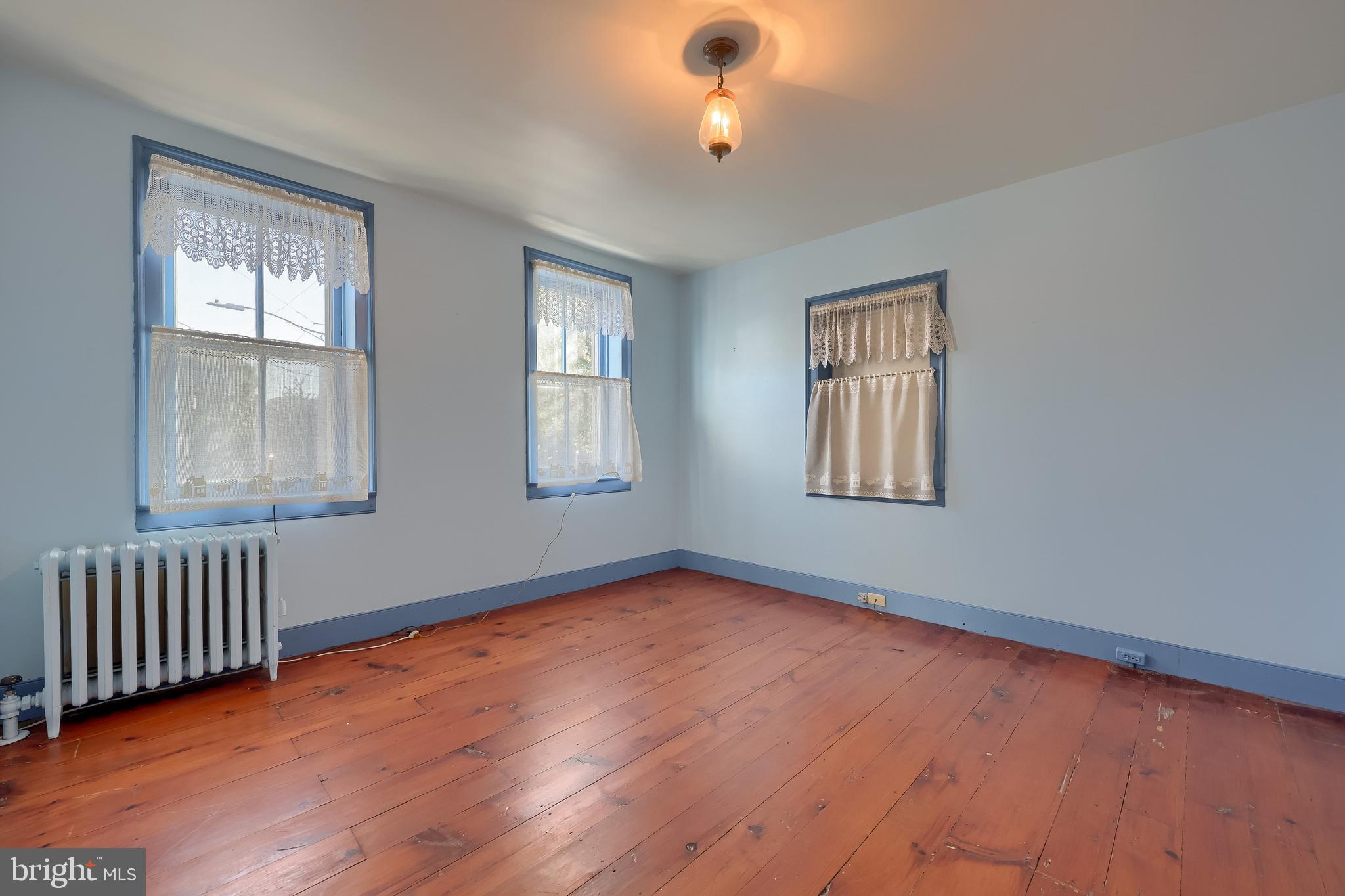 2 South Charlotte Street Manheim, PA 17545 - Photo 54 of 88 a view of an empty room with wooden floor and a window