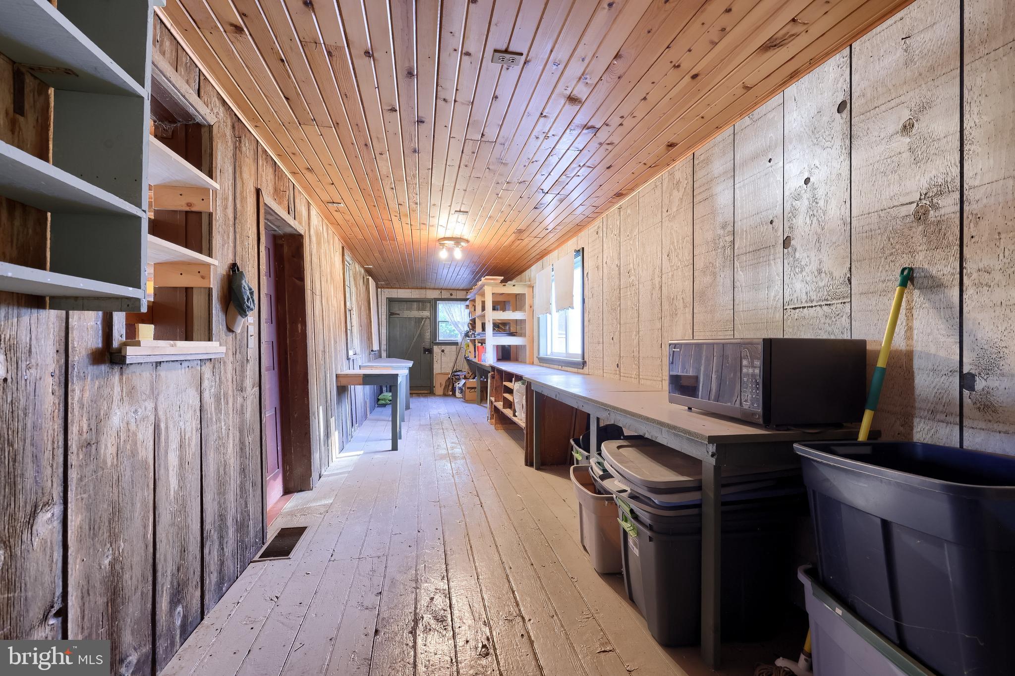 2 South Charlotte Street Manheim, PA 17545 - Photo 81 of 88 a kitchen with stainless steel appliances a refrigerator a sink dishwasher a stove and a dining table with wooden floor