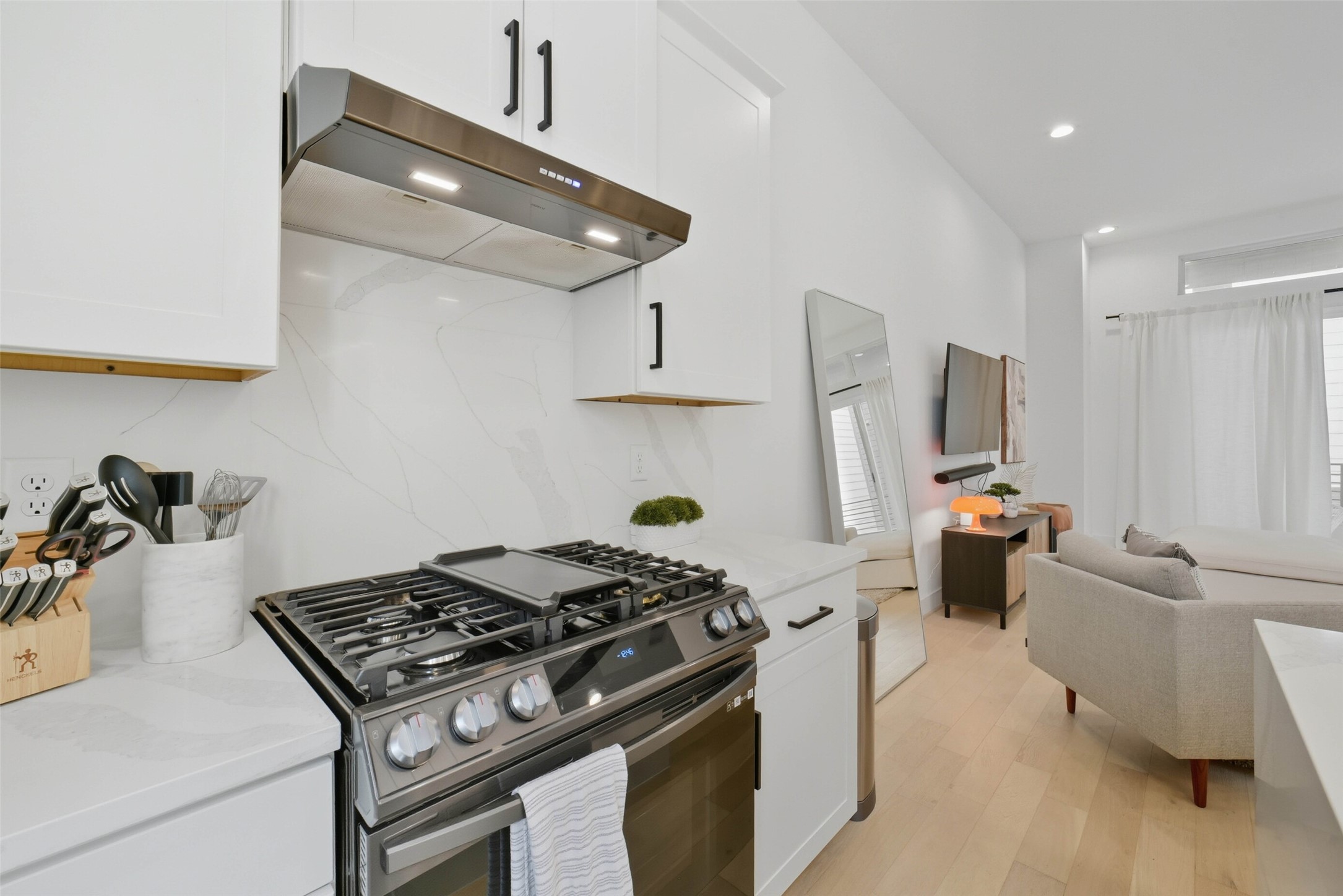 3006 Lamar Street Houston, TX 77003 - Photo 12 of 46 a kitchen with a stove and a refrigerator