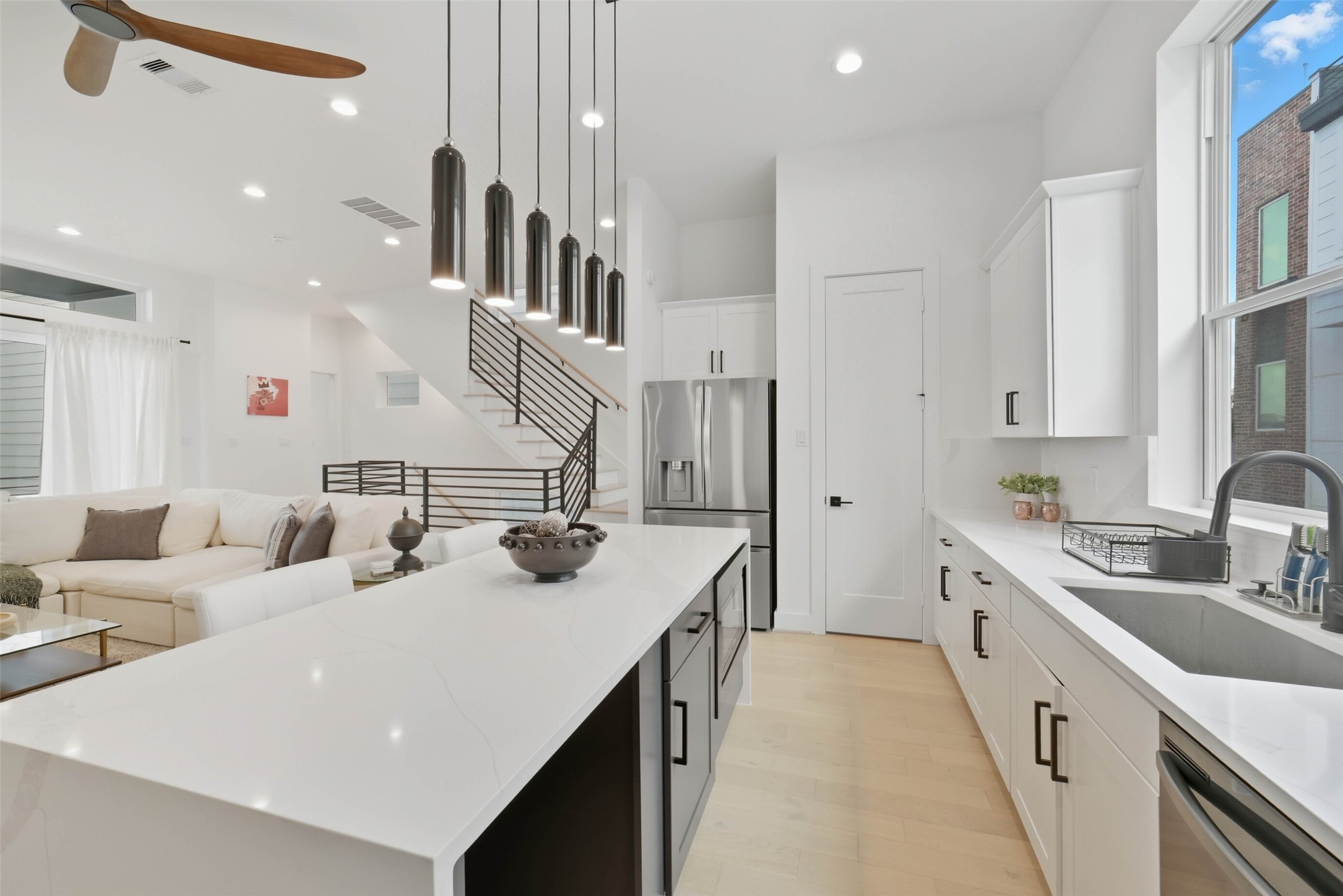 3006 Lamar Street Houston, TX 77003 - Photo 13 of 46 a kitchen with stainless steel appliances a sink dishwasher stove refrigerator and cabinets