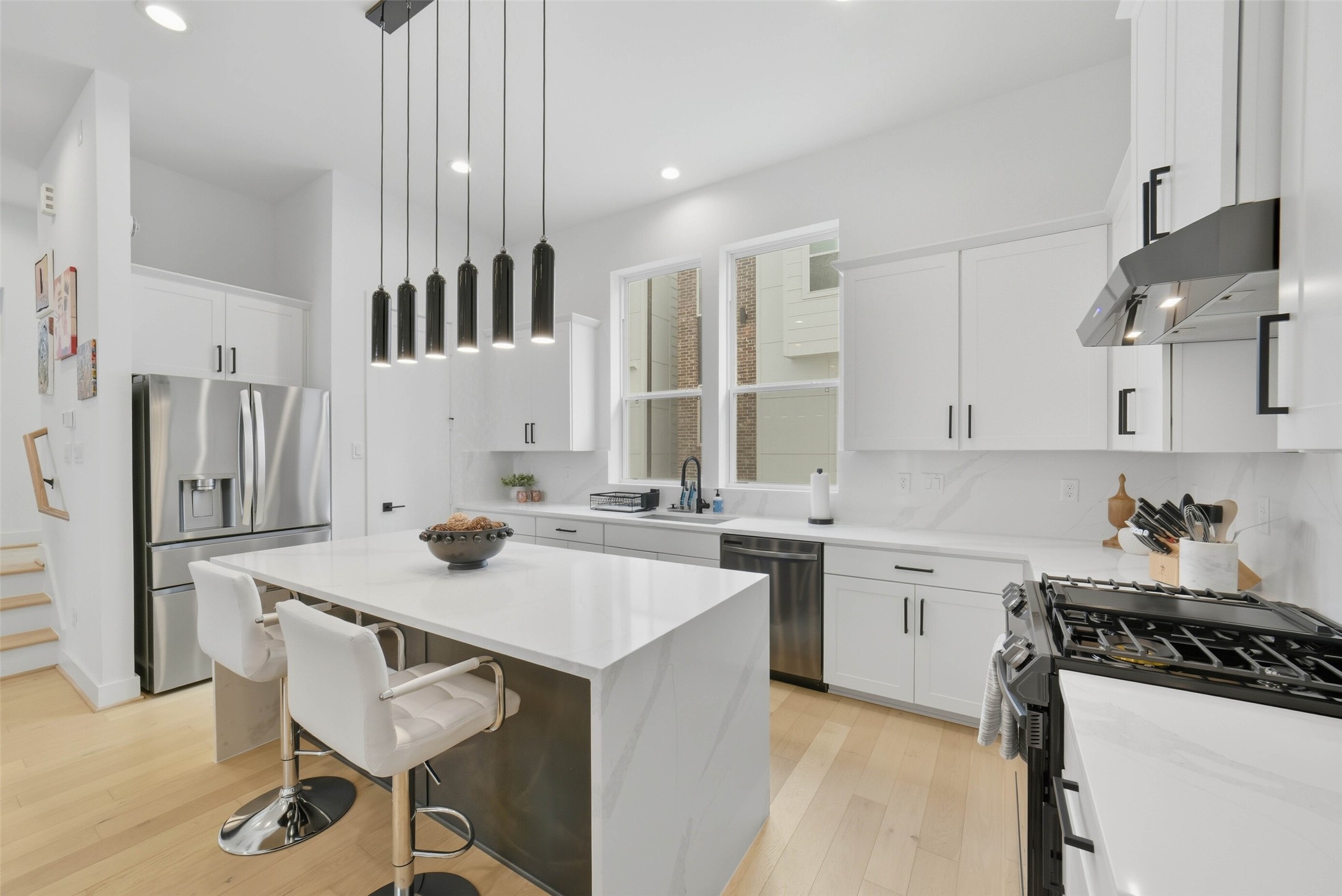 3006 Lamar Street Houston, TX 77003 - Photo 14 of 46 a kitchen with a stove a sink and a refrigerator