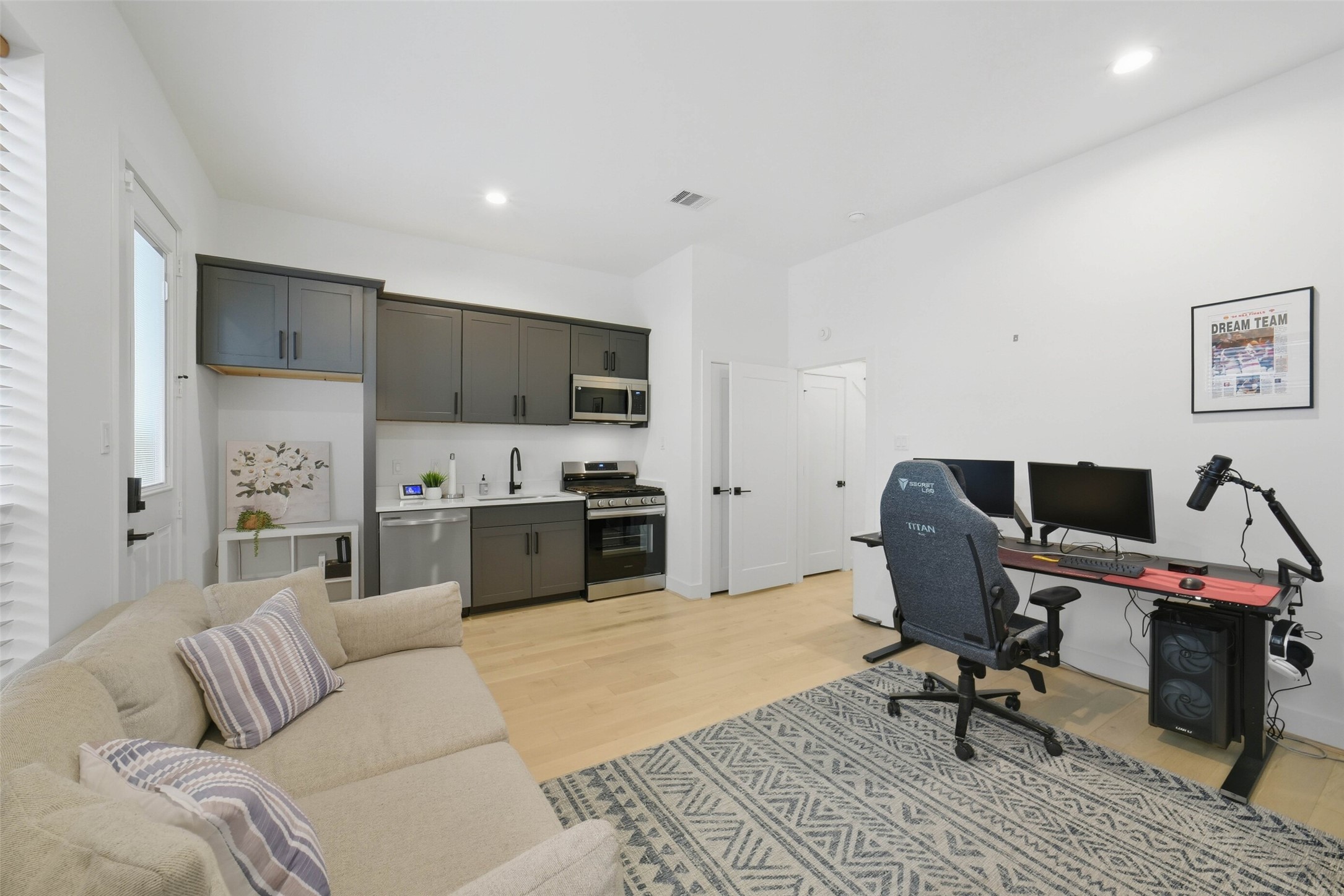 3006 Lamar Street Houston, TX 77003 - Photo 17 of 46 a living room with furniture and a dining table with kitchen view