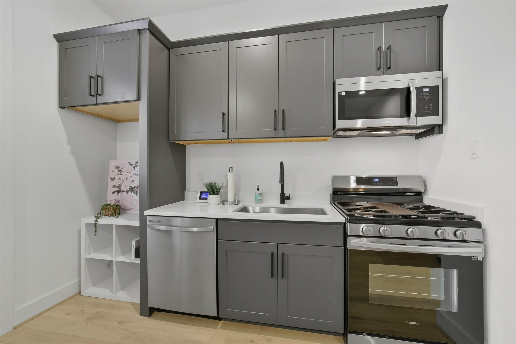 3006 Lamar Street Houston, TX 77003 - Photo 19 of 46 a kitchen with stainless steel appliances a stove and a microwave