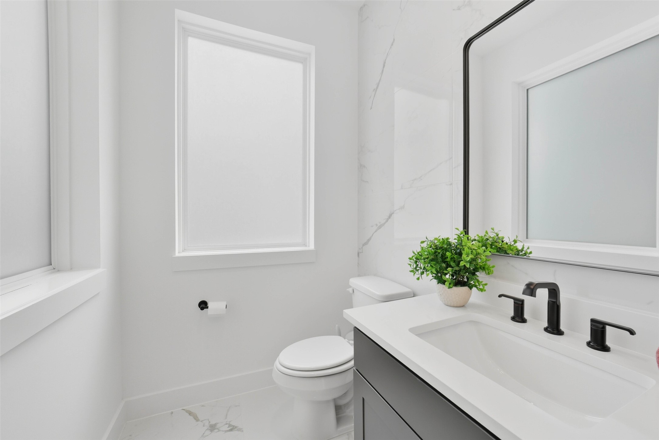 3006 Lamar Street Houston, TX 77003 - Photo 22 of 46 a bathroom with a sink toilet and vanity
