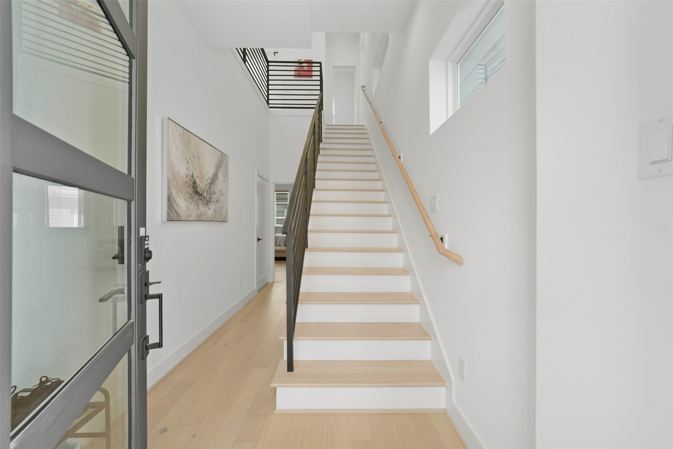 3006 Lamar Street Houston, TX 77003 - Photo 4 of 46 a view of staircase with white walls and a window