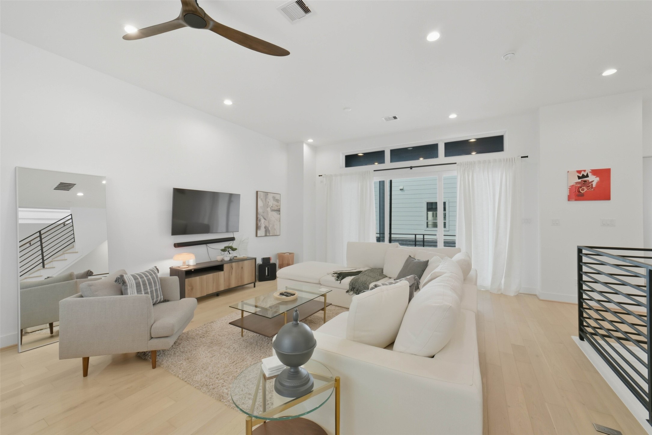 3006 Lamar Street Houston, TX 77003 - Photo 5 of 46 a living room with furniture kitchen view and a flat screen tv