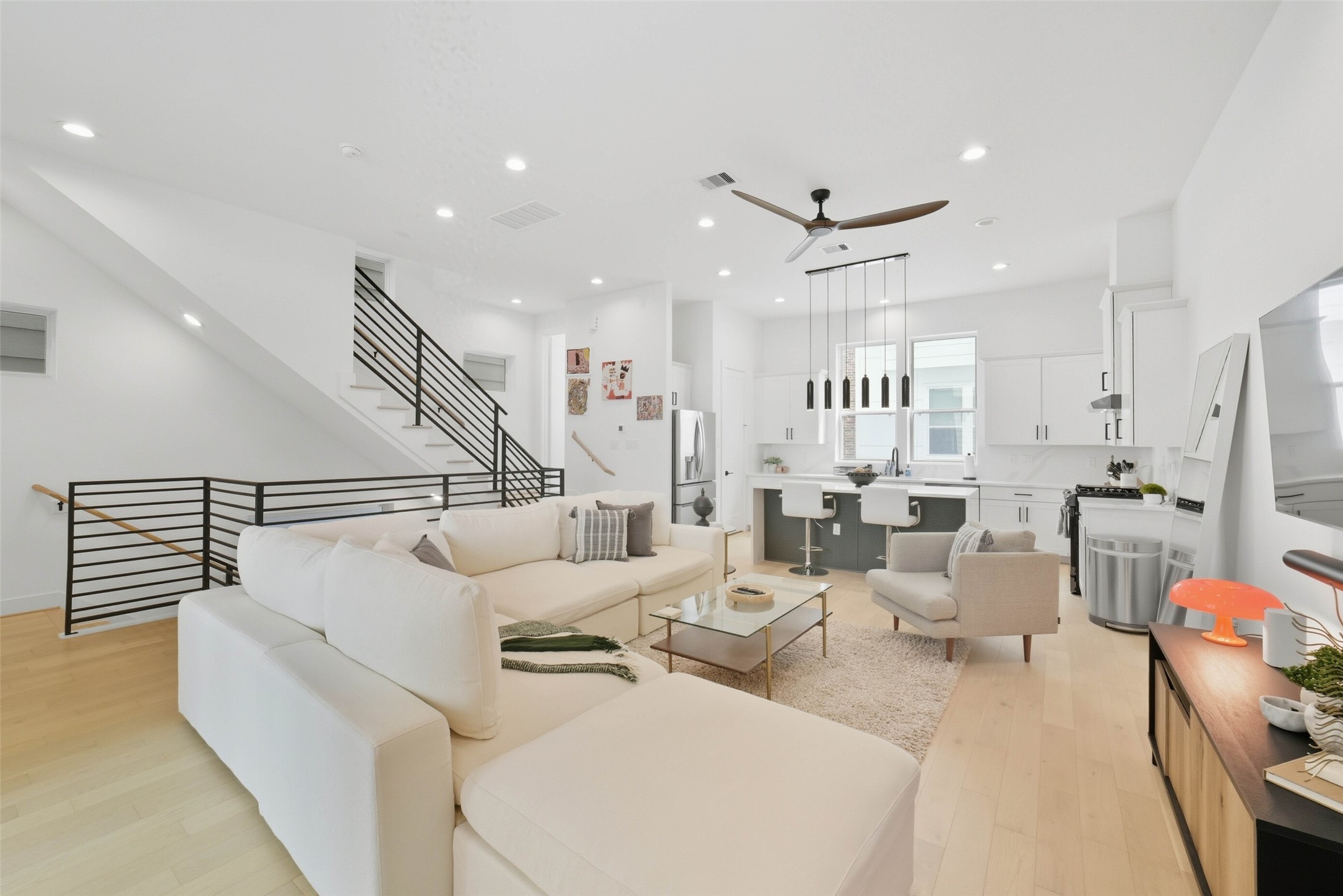 3006 Lamar Street Houston, TX 77003 - Photo 7 of 46 a living room with lots of furniture and a chandelier