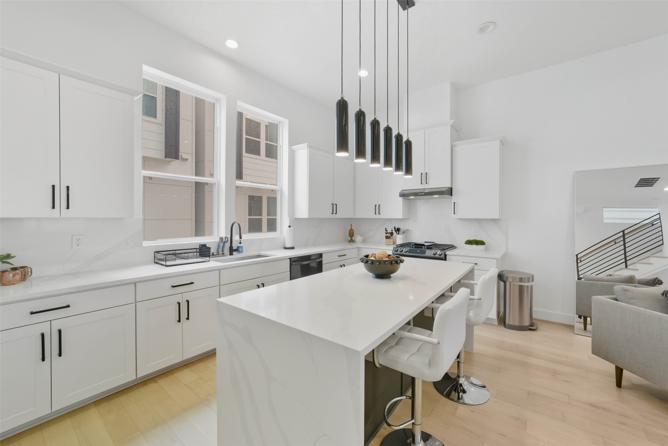 3006 Lamar Street Houston, TX 77003 - Photo 9 of 46 a kitchen that has a sink a stove and chairs