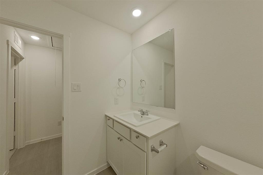834 Ginkgo Way Princeton, TX 75407 - Photo 14 of 27 a bathroom with a sink mirror and toilet