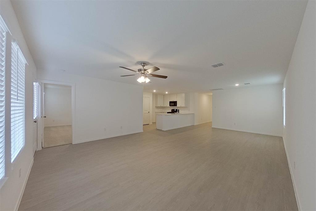 834 Ginkgo Way Princeton, TX 75407 - Photo 4 of 27 a view of a livingroom with a sink and chandelier fan