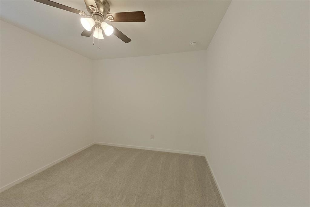 834 Ginkgo Way Princeton, TX 75407 - Photo 8 of 27 an empty room with a chandelier fan