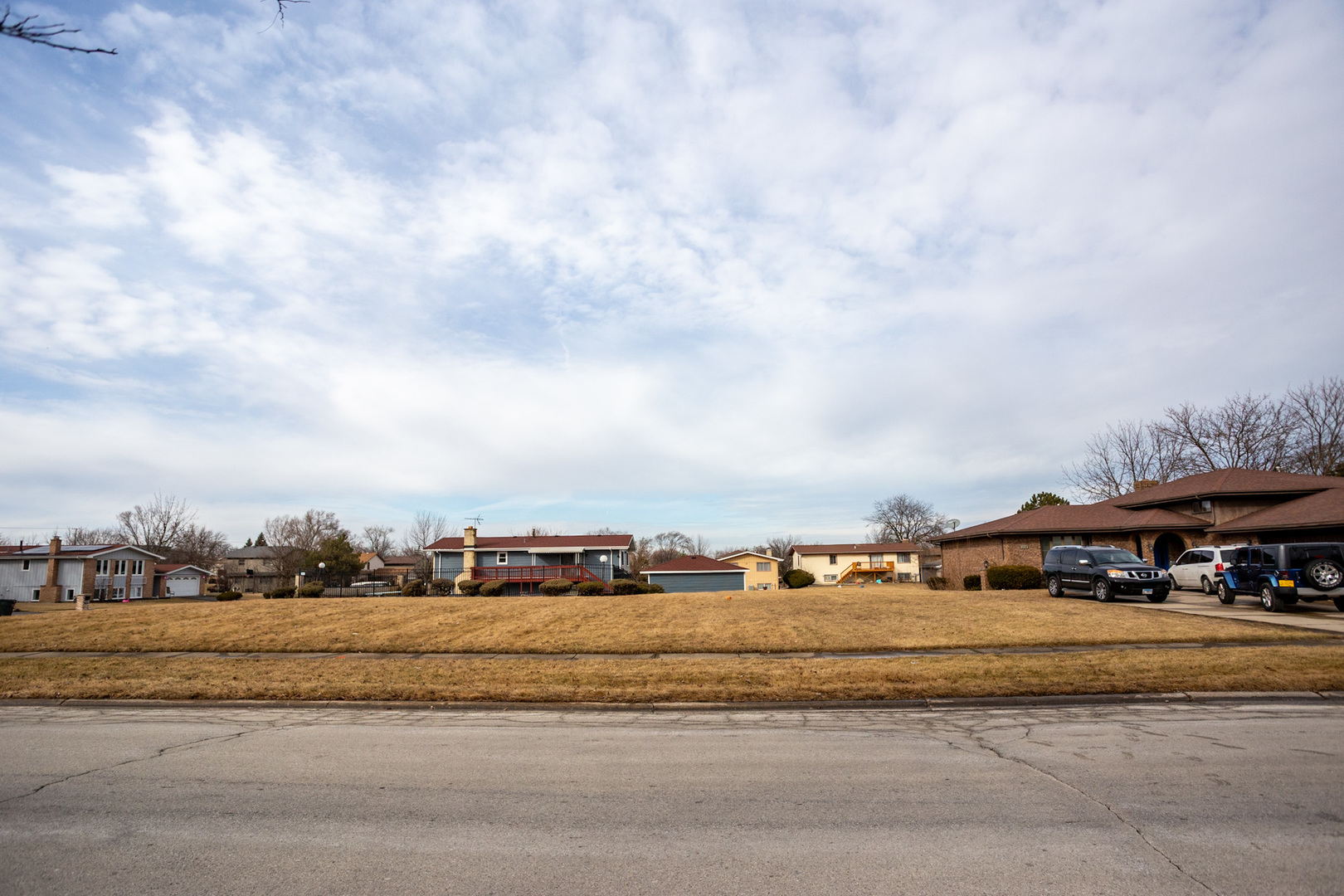 3112 Shagbark Lane Hazel Crest, IL 60429 - Photo 2 of 11 a view of road with multi story residential apartment building in front of it
