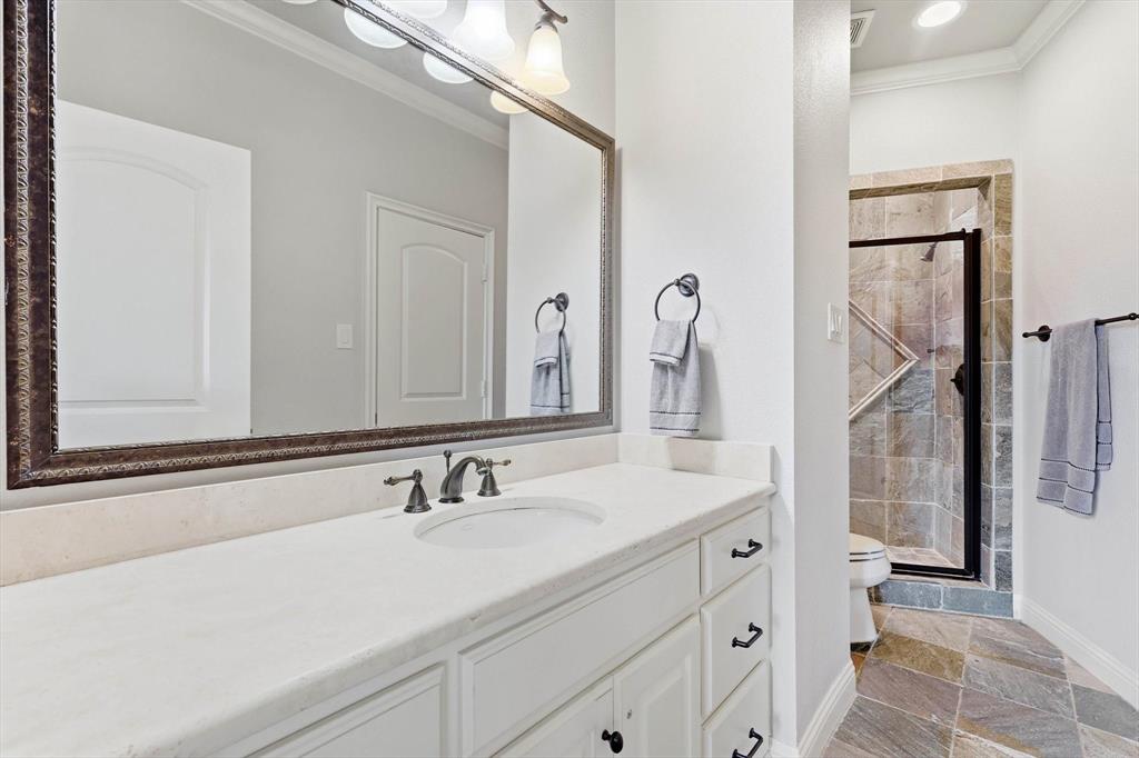 476 Hidden Valley Lane Coppell, TX 75019 - Photo 25 of 40 a bathroom with a sink and a mirror