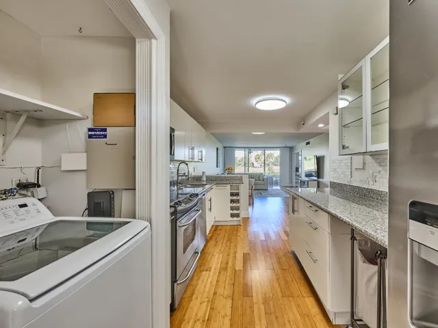a kitchen with a sink stove and refrigerator