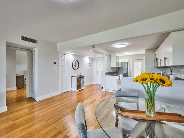 a view of a dining room with furniture and a table