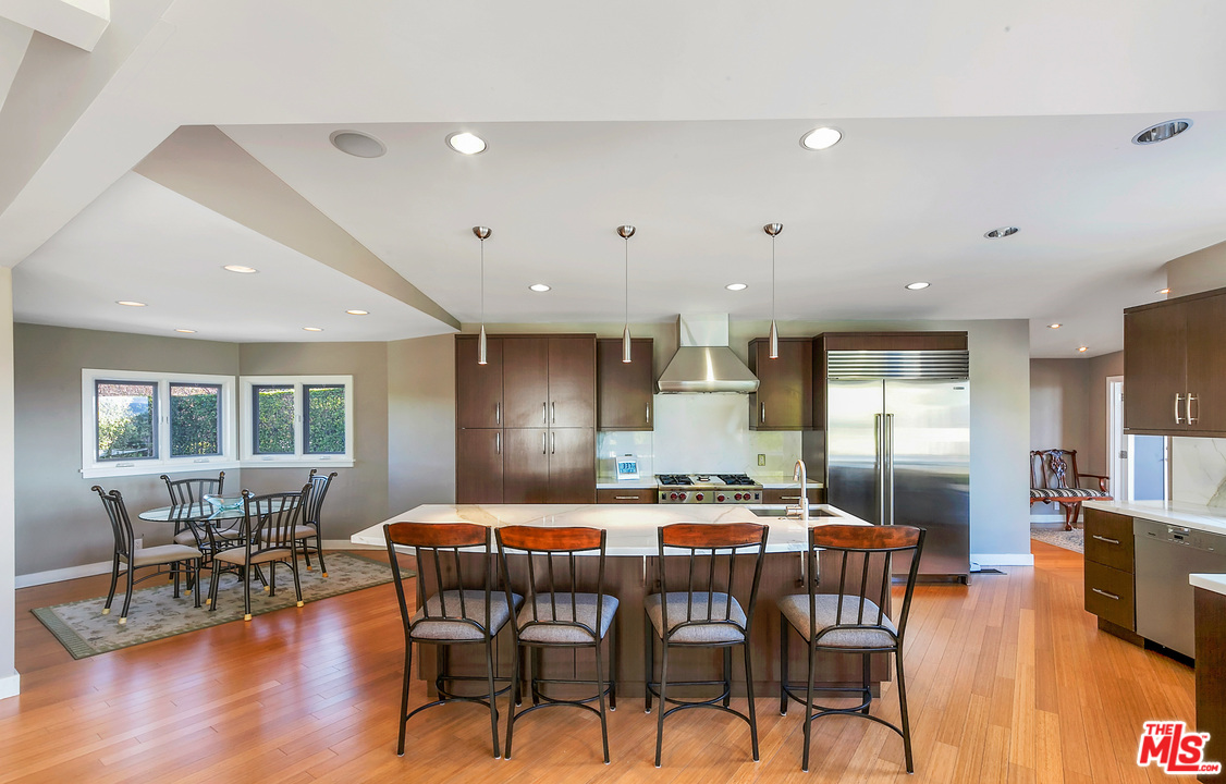 3921 Cody Road Sherman Oaks, CA 91403 - Photo 10 of 36 a dining room with furniture and wooden floor